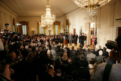 President George W. Bush looks on during the swearing-in ceremony for U.S. Supreme Court Justice Samuel A. Alito, Tuesday, Feb. 1, 2006 in the East Room of the White House, sworn-in by U.S. Supreme Court Chief Justice John Roberts. Altio's wife, Martha-Ann, their son Phil and daughter, Laura, are seen center-background. White House photo by Shealah Craighead