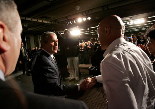 President George W. Bush greets employees after his remarks on American competitiveness at the 3M Corporation in Maplewood, Minn., Thursday, Feb. 2, 2006. White House photo by Eric Draper