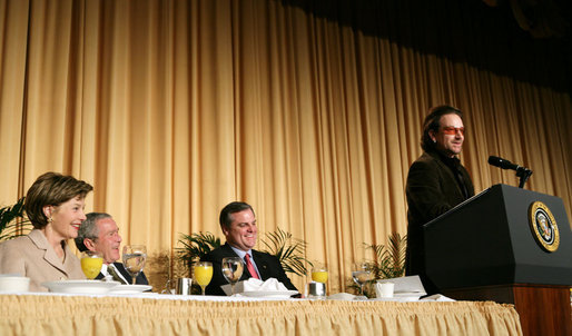 President George W. Bush, Laura Bush and Sen. Mark Pryor (D-Ark.) break out in laughter as Bono speaks during the National Prayer Breakfast Thursday morning at the Hilton Washington Hotel. White White House photo by Paul Morse