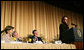 President George W. Bush, Laura Bush and Sen. Mark Pryor (D-Ark.) break out in laughter as Bono speaks during the National Prayer Breakfast Thursday morning at the Hilton Washington Hotel. White White House photo by Paul Morse