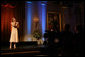 President George W. Bush and Laura Bush listen to country music artist LeAnn Rimes perform in the East Room of the White House during a dinner honoring The Dance Theatre of Harlem Monday, February 6, 2006. White House photo by Shealah Craighead