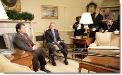 President George W. Bush listens as King Abdullah of Jordan makes remarks Wednesday, Feb. 8, 2006, during a photo opportunity in the Oval Office. The two leaders took the opportunity to urge an end to recent violence over caricatures of the Prophet Mohammed.  White House photo by Eric Draper