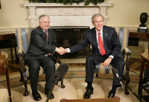 President George W. Bush welcomes Poland's President Lech Kaczynski to the Oval Office at the White House, Thursday, Feb. 9, 2006 in Washington. White House photo by Eric Draper