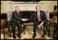 President George W. Bush welcomes Poland's President Lech Kaczynski to the Oval Office at the White House, Thursday, Feb. 9, 2006 in Washington. White House photo by Eric Draper