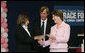 Mrs. Laura Bush presents the first Komen Italia Award, Thursday, Feb. 9, 2006 to Mrs. Marisa Giannini, a cancer survivor and the director of the Philatelic division of the Italian Postal Service, for her volunteer services with Koman Italia of The Susan G. Komen Breast Cancer Foundation. White House photo by Shealah Craighead