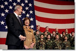 Laura Bush stands with U.S Ambassador to Italy Ron Spogli before speaking with troops during a visit to Aviano Air Base, in Aviano, Italy, Friday, Feb. 10, 2006. White House photo by Shealah Craighead