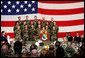 Mrs. Laura Bush addresses an audience of U.S.troops during a visit to Aviano Air Base, in Aviano, Italy, Friday, Feb. 10, 2006. White House photo by Shealah Craighead