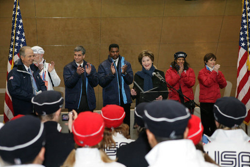 Mrs. Laura Bush, is joined by former Olympians, as she speaks to U.S. 2006 Winter Olympic athletes in Turin, Italy, Friday, Feb. 10, 2006, prior to the Winter Olympic opening ceremony. 