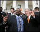 President George W. Bush poses with University of Texas Longhorns assistant coach Jeff 'Mad Dog' Madden, as they give the 'Hook Em Horns' sign, Tuesday, Feb. 14, 2006 on the South Lawn of the White House, during ceremonies to honor the 2005 NCAA Football Champions. White House photo by Paul Morse