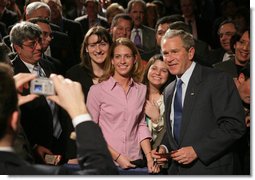 President George W. Bush takes a moment to pose for a picture with audience members Wednesday, Feb. 15, 2006 at Wendy's International, Inc. corporate headquarters in Dublin, Ohio, following his remarks on health care, and his commitment to help all Americans gain access to affordable, high-quality health care. White House photo by Paul Morse