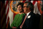 Laura Bush sits with Carlos del la Cruz, Event Host, during a Junior Ranger event Wednesday, Feb. 15, 2006, in Coral Gables, FL. The Junior Ranger programs introduces young people to America's national parks and historic sites, and is operating in 286 of the 388 National Parks across the country. White House photo by Shealah Craighead