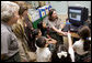 Laura Bush and Fran Mainella look on as students of Stella Summer’s Gifted Science class work with Ranger Maria Beotegui Thursday, Feb. 16, 2006, to navigate through Web Rangers, the online version of Junior Rangers, during a visit to Banyan Elementary School in Miami, FL. The National Junior Ranger Programs promote knowledge of science, history, the environment and learning through fun. White House photo by Shealah Craighead