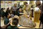 Laura Bush, listens to a student talk about Sea Turtles, Thursday, Feb. 16, 2006, as Fran Mainella, Director of the National Park Service, and Stella Summers, Teacher of the Gifted Science class, look on during a visit to Banyan Elementary School in Miami, FL, to support education about parks and the environment. White House photo by Shealah Craighead