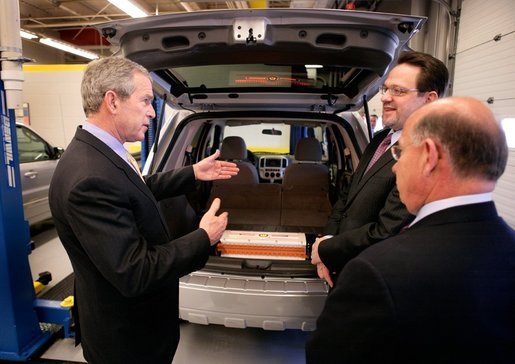 President George W. Bush views a hybrid vehicle powered by Lithium-ion batteries during a tour by Johnson Controls' CEO John Barth, far right, and employee Mike Andrew at the Johnson Controls' Battery Technology Center in Glendale, Wisconsin, Monday, Feb. 20, 2006. White House photo by Eric Draper