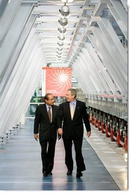 President George W. Bush and Dr. Subhendu Guha, President of United Solar Ovonic LLC, tour the company's solar cell production area in Auburn Hills, Michigan, Monday, Feb. 20, 2006.  White House photo by Eric Draper