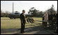 President George W. Bush talks wiith reporters on the South Lawn of the White House, Tuesday, Feb. 21, 2006, supporting the right of a United Arab Emirates business, following a thorough U.S. government review, to purchase the rights to manage six U.S. seaports. President Bush also emphasized that the security of the ports would continue to be managed by the U.S. Coast Guard and U.S. Customs. White House photo by Kimberlee Hewitt