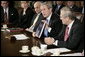 President George W. Bush holds a copy of the newly released report, The Federal Response to Hurricane Katrina: Lessons Learned, while talking to reporters at a Cabinet meeting Thursday, Feb. 23, 2006 at the White House. The report reviews the federal response to Katrina and makes recommendations about how to better respond in the future. White House photo by Eric Draper