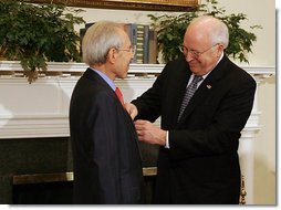 Vice President Dick Cheney presents the Distinguished Service Cross to Lieutenant Bernard W. Bail in the Roosevelt Room at the White House, Friday, February 24, 2006. The Distinguished Service Cross is awarded to a person who while serving in any capacity with the U.S. Army distinguished himself or herself by extraordinary heroism. After Lt. Bail’s aircraft took heavy anti-aircraft fire that killed the pilot and wounded other crew members over the English Channel on June 5, 1944, Lt. Bail displayed such acts of valor and ultimately prevented the aircraft, loaded with a full ordnance, from crashing into an English village.  White House photo by David Bohrer