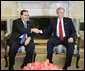 President George W. Bush welcomes President Antonio Saca of El Salvador to the Oval Office, Friday, Feb. 24, 2006 at the White House. White House photo by Eric Draper