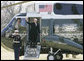 President George W. Bush waves as he prepares to leave the South Lawn of White House aboard Marine One, Tuesday, Feb. 28, 2006, to Andrews Air Force Base to begin a five day trip to visit India and Pakistan. White House photo by Kimberlee Hewitt