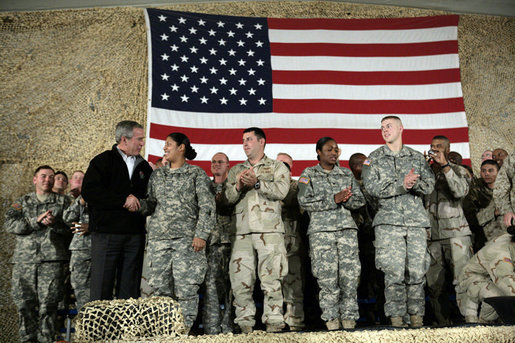 President George W. Bush meets and thanks a group of U.S. and Coalition troops, Wednesday, March 1, 2006, during a visit to Bagram Air Base in Afghanistan, where President Bush thanked the troops for their service in defense of freedom. White House photo by Eric Draper