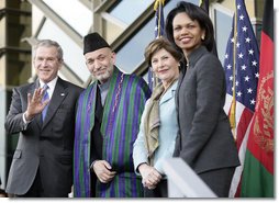 President George W. Bush waves as he stands with President Hamid Karzai of Afghanistan, Mrs. Laura Bush and Secretary of State Condoleezza Rice during welcoming ceremonies Wednesday, March 1, 2006, in Kabul.  White House photo by Eric Draper