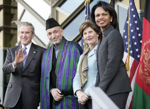 President George W. Bush waves as he stands with President Hamid Karzai of Afghanistan, Mrs. Laura Bush and Secretary of State Condoleezza Rice during welcoming ceremonies Wednesday, March 1, 2006, in Kabul. White House photo by Eric Draper