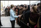 Mrs. Laura Bush greets a welcoming delegation of women, Wednesday, March 1, 2006, at the dedication of the new U.S. Embassy Building in Kabul, Afghanistan. White House photo by Eric Draper