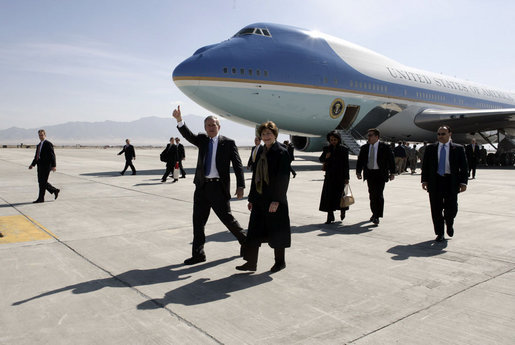 President George W. Bush gives the thumbs-up after Air Force One landed at Bagram Air Base near Kabul, Afghanistan Wednesday, March 1, 2006. The five-hour surprise visit included a meeting with Afghan President Karzai, a ceremonial ribbon-cutting at the U.S. Embassy, and a visit to the troops at Bagram. White House photo by Eric Draper