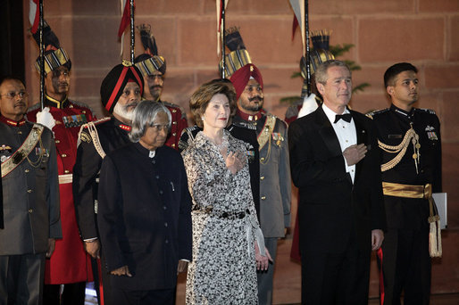 President and Mrs. Bush stand with India's President A.P.J. Abdul Kalam during the playing of their respective national anthems Thursday, March 2, 2006, at the State Dinner in New Delhi. White House photo by Eric Draper