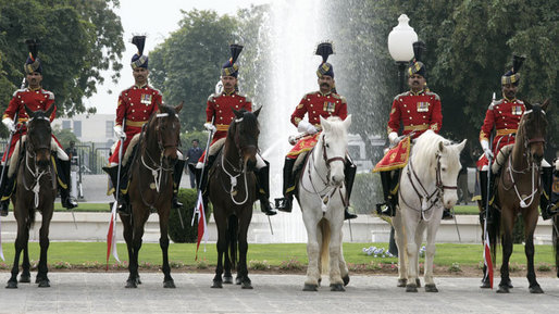 A Pakistan cavalry honor guard welcomes President George W. Bush to Aiwan-e-Sadr in Islamabad, Pakistan, Saturday, March 4, 2006. White House photo by Eric Draper