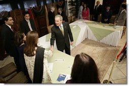 President George W. Bush greets participants, Saturday, March 4, 2006 at the Roundtable with Pakistani Society Representatives at the U.S. Embassy in Islamabad, Pakistan.  White House photo by Eric Draper