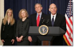 President George W. Bush stands with Victoria Lazear and her daughter Julie as Eddie Lazear offers remarks Monday, March 6, 2006, after being sworn in as Chairman of the Council of Economic Advisers. White House photo by Paul Morse