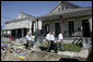 President George W. Bush views the destruction to homes and debris piles while touring the lower 9th Ward of New Orleans, Wednesday, March 8, 2006 with New Orleans Mayor Ray Nagin, right. White House photo by Eric Draper