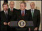 President George W. Bush addresses the audience after signing H.R. 3199, USA Patriot Improvement and Reauthorization Act of 2005, Thursday, March 9, 2006 in the East Room of the White House. President Bush is joined by U.S. Congressman Roy Blunt, R-Mo., left, U.S. Senator Larry Craig, R-Id., background-left, and Homeland Security Secretary Michael Chertoff. White House photo by Kimberlee Hewitt