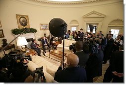 President George W. Bush and Peru's President Alejandro Toledo talk with reporters during their Oval Office visit, Friday, March 10, 2006 at the White House.  White House photo by Eric Draper