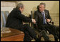 President George W. Bush and Prime Minister Mikulas Dzurinda of Slovakia, exchange handshakes during remarks in the Oval Office of the White House Monday, March 13, 2006. President Bush thanked the Prime Minister for his contributions to helping the young democracies in Afghanistan and Iraq succeed. White House photo by Paul Morse