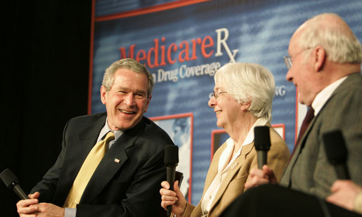 President George W. Bush participates in a Conversation on the Medicare Prescription Drug Benefit, Tuesday, March 14, 2006 at the Canandaigua Academy in Canandaigua, N.Y., speaking with Bob and Eleanor Wisnieff. White House photo by Kimberlee Hewitt