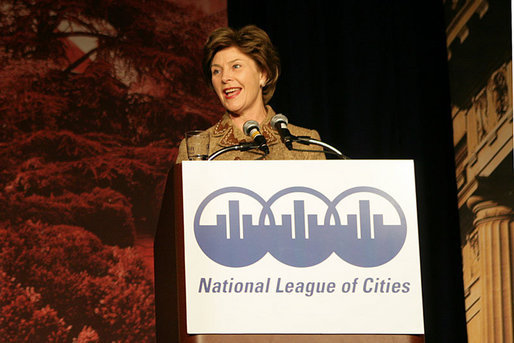 Mrs. Laura Bush addresses an audience Tuesday, March 14, 2006 at the National League of Cities Conference in Washington, asking for their communities continued support of the Helping America's Youth initiative. White House photo by Shealah Craighead