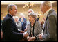 President George W. Bush is applauded as he arrives Tuesday, March 14, 2006 to the Ferris Hills at West Lake Senior Center in Canandaigua, N.Y., to discuss the benefits of the new Medicare prescription drug program. White House photo by Kimberlee Hewitt