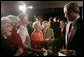 President George W. Bush meets with audience members following his remarks on the new Medicare Prescription Drug Benefit Program at the Riderwood Villiage retirement community, Wednesday, March 15, 2006 in Silver Spring, Md. President Bush urged seniors to get information about the new Medicare benefit program and sign up by the May 15th deadline. White House photo by Paul Morse