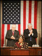 Vice President Dick Cheney and House Speaker J. Dennis Hastert applaud Liberian President Ellen Johnson-Sirleaf during an address to a Joint Meeting of Congress, Wednesday, March 15, 2006. The President’s speech marked the beginning of a multi-day trip to Washington that will include meetings with US officials in an effort to garner support as she leads her country in economic reconstruction and reform. White House photo by David Bohrer