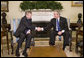 President George W. Bush welcomes NATO Secretary General Jaap de Hoop Scheffer to the Oval Office at the White House, Monday, March 20, 2006 in Washington. White House photo by Kimberlee Hewitt