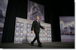 President George W. Bush walks on stage at the Renaissance Cleveland Hotel in Cleveland, Ohio, to deliver his remarks on the global war on terror, Monday, March 20, 2006, to members of the City Club of Cleveland.  White House photo by Paul Morse