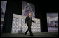 President George W. Bush walks on stage at the Renaissance Cleveland Hotel in Cleveland, Ohio, to deliver his remarks on the global war on terror, Monday, March 20, 2006, to members of the City Club of Cleveland. White House photo by Paul Morse