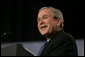 President George W. Bush reacts to a question from the audience at the Renaissance Cleveland Hotel in Cleveland, Ohio, while delivering his remarks on the global war on terror, Monday, March 20, 2006, to members of the City Club of Cleveland. White House photo by Paul Morse