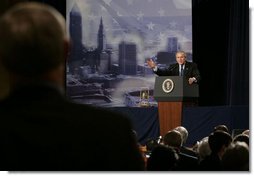 President George W. Bush answers a question from an audience member at the Renaissance Cleveland Hotel in Cleveland, Ohio, following his remarks on the global war on terror, Monday, March 20, 2006, to members of the City Club of Cleveland.  White House photo by Paul Morse