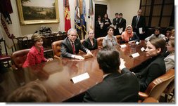 President George W. Bush and Mrs. Laura Bush meet Tuesday, March 21, 2006 in the Roosevelt Room of the White House, with members of the Iraq and Afghanistan Non-Govermental Organizations. White House photo by Eric Draper