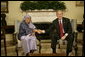 President George W. Bush welcomes Liberia's President Ellen Johnson Sirleaf to the Oval Office at the White House, Tuesday, March 21, 2006. President Sirleaf is the first woman elected President to any country on the continent of Africa. White House photo by Eric Draper