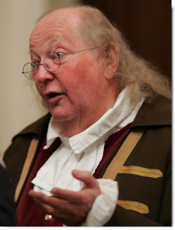 Benjamin Franklin interpreter, Ralph Archbold of Philadelphia, Pa., speaks with guests Thursday evening, March 23, 2006 in the Blue Room of the White House, at a Social Dinner hosted by President George W. Bush and Mrs. Laura Bush to honor the 300th birthday of Benjamin Franklin.  White House photo by Paul Morse